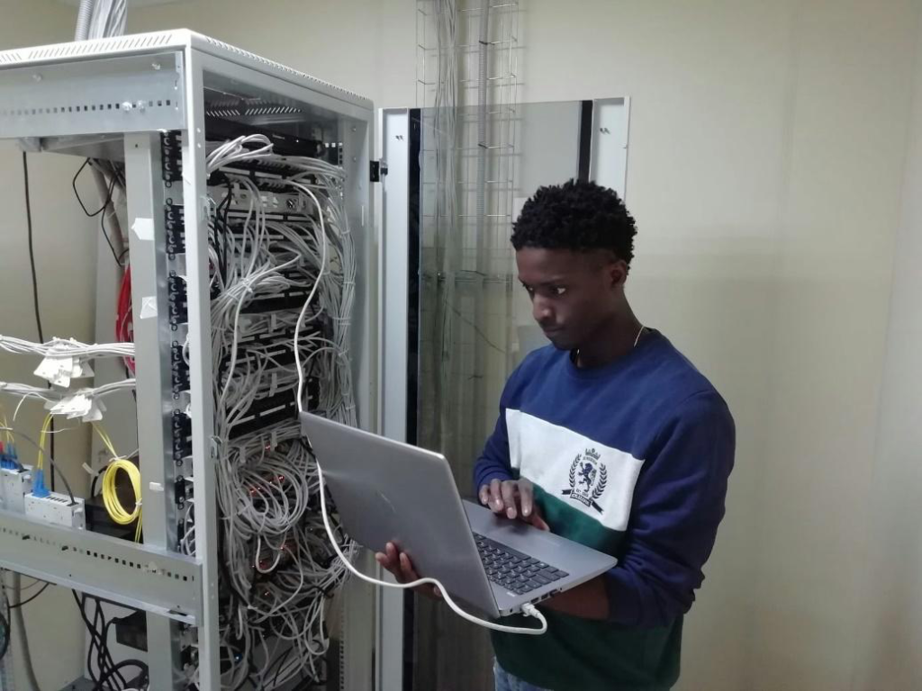 IT technician configuring servers to improve software integration and network performance.