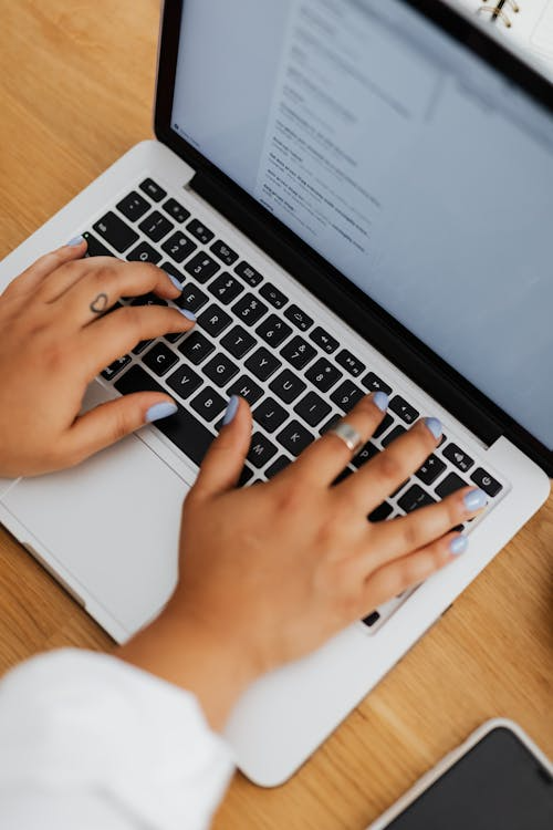 An image of an employee working on her laptop.